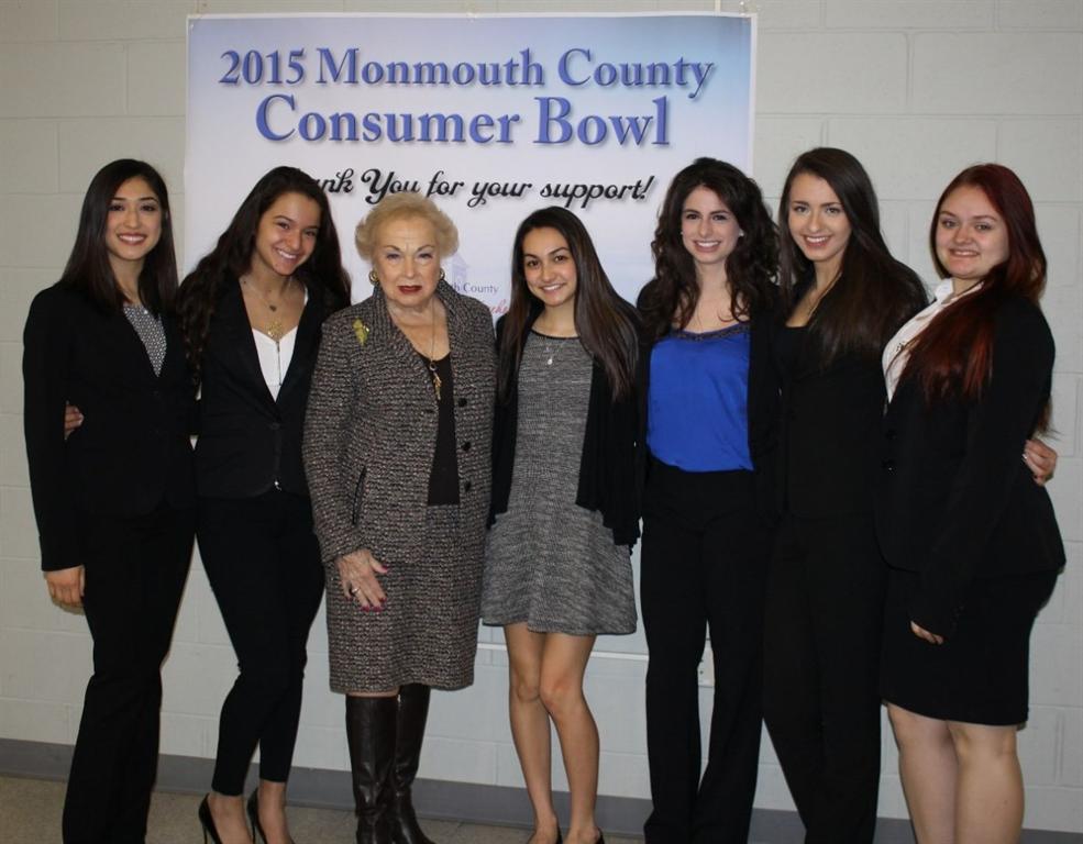 Freeholder Lillian G. Burry is pictured with Colts Neck High School students at the 2015 Monmouth County Consumer Bowl on March 30.